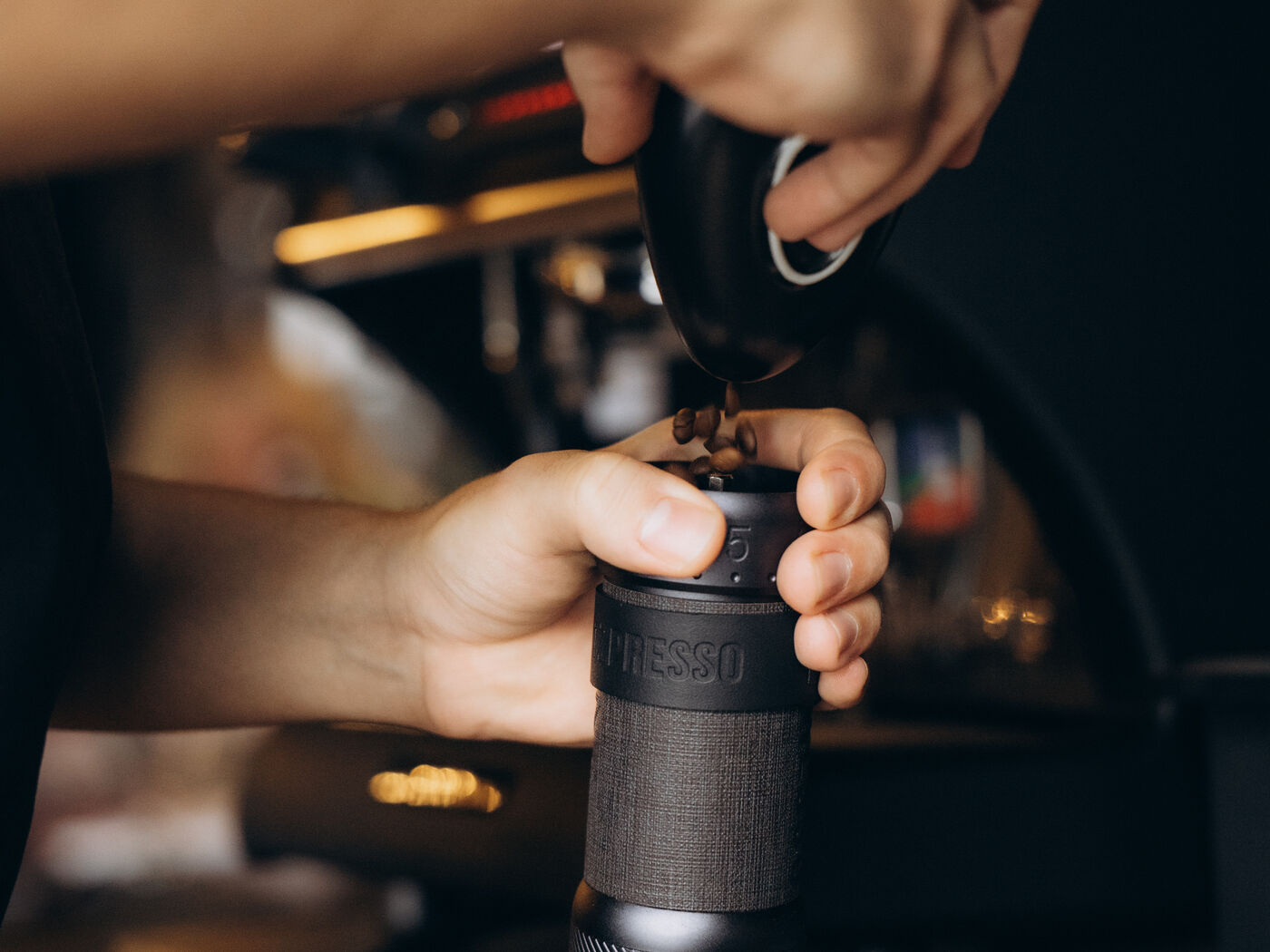 Grinding coffee by hand at the table